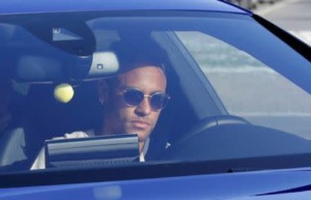 Brazilian soccer player Neymar drives to arrive to Joan Gamper training camp near Barcelona, Spain, August 2, 2017. REUTERS/Stringer