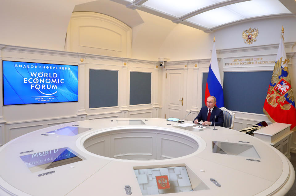 Russian President Vladimir Putin speaks to participants of the the World Economic Forum via a video link in Moscow, Russia, Wednesday, Jan. 27, 2021. Putin warned of rising global tensions and growing risks of new conflicts and called for broader international cooperation to tackle new challenges. (Mikhail Klimentyev, Sputnik, Kremlin Pool Photo via AP)