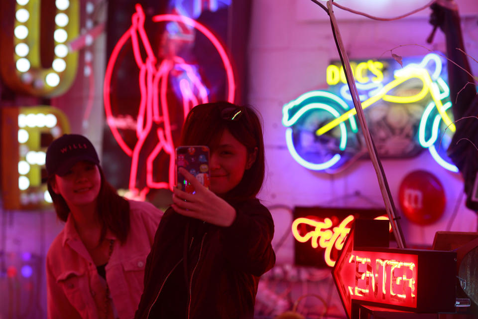 Tourists take selfies