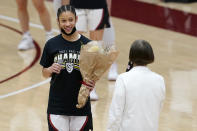 Stanford guard Anna Wilson, left, listens to head coach Tara VanDerveer speak as she and other senior players are honored after Stanford defeated California in an NCAA college basketball game in Stanford, Calif., Sunday, Feb. 28, 2021. (AP Photo/Jeff Chiu)