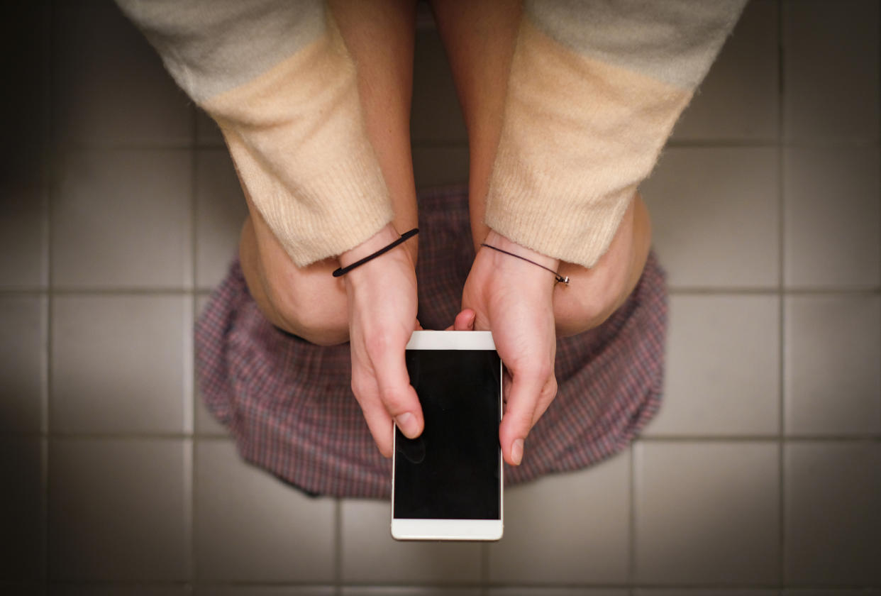 <em>More than half of Brits admit to using their phone on the loo (Picture: Getty)</em>