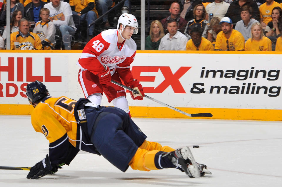 NASHVILLE, TN - APRIL 13: Cory Emmerton #48 of the Detroit Red Wings lines up before scoring a goal against the Nashville Predators in Game Two of the Western Conference Quarterfinals during the 2012 NHL Stanley Cup Playoffs at the Bridgestone Arena on April 13, 2012 in Nashville, Tennessee. (Photo by Frederick Breedon/Getty Images)