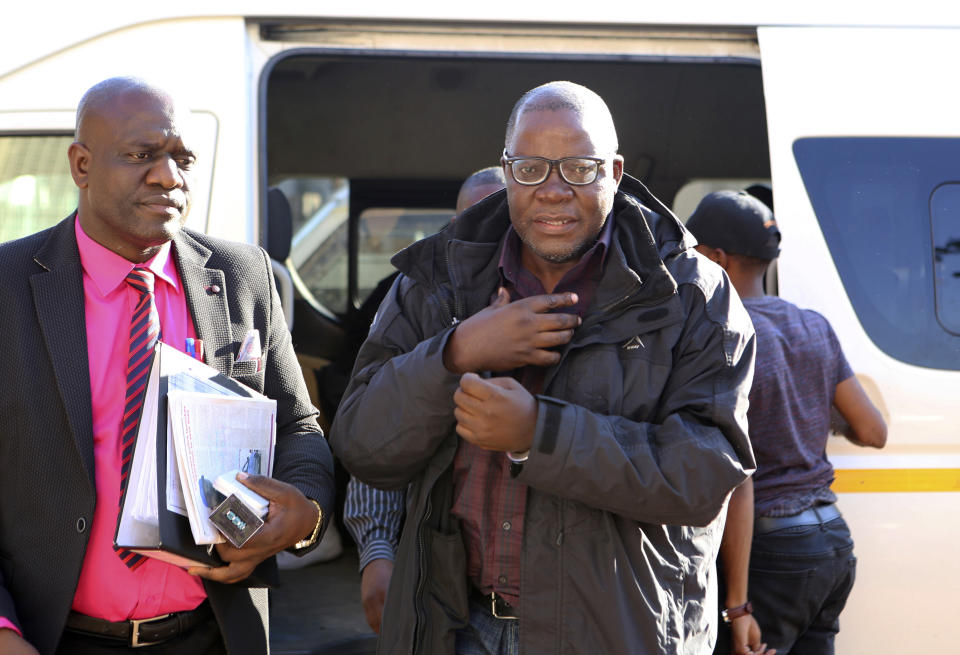 Zimbabwean opposition official Tendai Biti arrives at the magistrates courts in Harare, Thursday Aug. 9, 2018. Biti was deported to Zimbabwe following his arrest in Zambia after his asylum bid was rejected. Biti's plight has raised concerns about a wave of repression against the opposition by the government of Zimbabwe's President Emmerson Mnangagwa. (AP Photo/Tsvangirayi Mukwazhi)