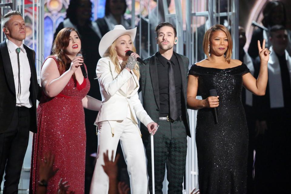 Performers, from left, Macklemore, Mary Lambert, Madonna, Ryan Lewis and Queen Latifah appear on stage during a performance of "Same Love" at the 56th annual Grammy Awards at Staples Center on Sunday, Jan. 26, 2014, in Los Angeles. (Photo by Matt Sayles/Invision/AP)