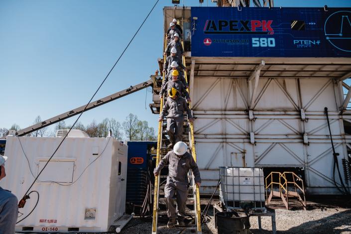 A group of Buckeye Career Center Energy Operations and Natural Resources students disembark &quot;The Dog House&quot; during a learning tour at the Encino Energy Leeper rig and well pad on Thursday in Sherrodsville.