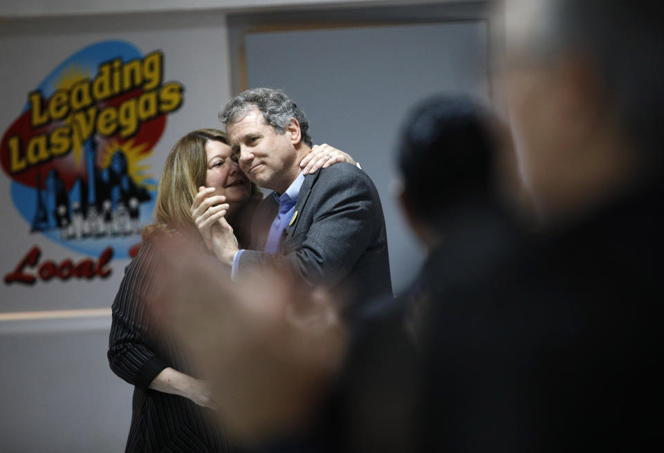 U.S. Sen. Sherrod Brown, D-Ohio, gets a kiss from wife Connie Schultz before speaking at a Culinary Union hall Saturday, Feb. 23, 2019, in Las Vegas. (Photo: John Locher/AP)