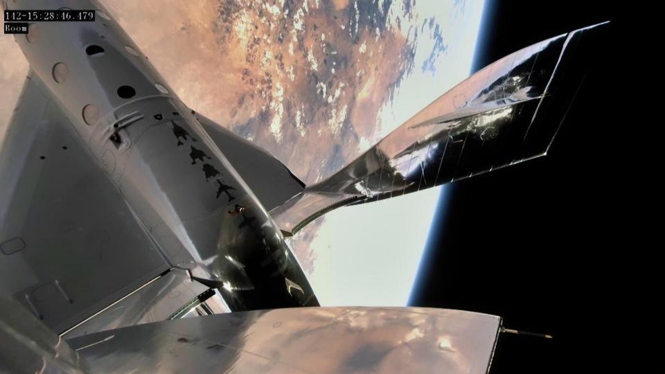 The Virgin Galactic spacecraft above earth