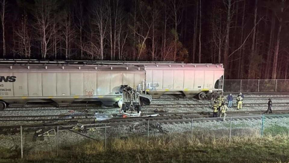 Cadillac CTS Goes Flying, Crashes Into Train Tracks