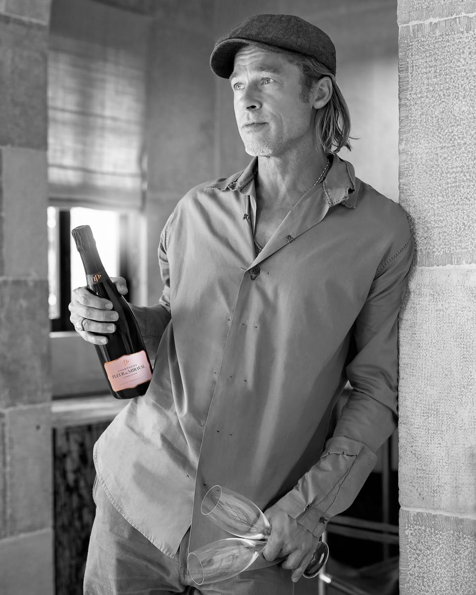 Brad Pitt with a bottle of Champagne Fleur de Miraval