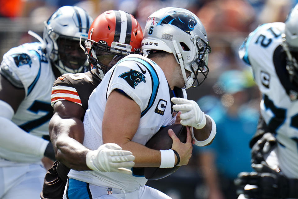 Carolina Panthers quarterback Baker Mayfield is sacked by Cleveland Browns defensive end Myles Garrett during the second half of an NFL football game on Sunday, Sept. 11, 2022, in Charlotte, N.C. (AP Photo/Rusty Jones)