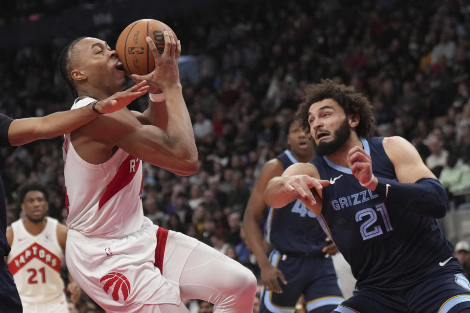 Toronto Raptors forward Scottie Barnes (4) attempts to drive past Memphis Grizzlies forward David Roddy (21) during the second half of an NBA basketball game in Toronto, Monday Jan. 22, 2024. (Nathan Denette/The Canadian Press via AP)