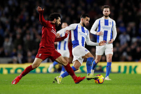 Soccer Football - Premier League - Brighton & Hove Albion v Liverpool - The American Express Community Stadium, Brighton, Britain - January 12, 2019 Brighton's Martin Montoya in action with Liverpool's Mohamed Salah Action Images via Reuters/Paul Childs