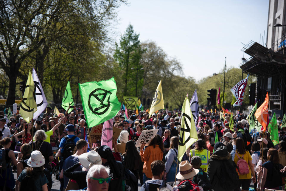LONDON, UNITED KINGDOM - 2022/04/16: Protestors gather at Marble Arch, Hyde Park holding flags during the Extinction Rebellion's End to Fossil Fuels protest in Central London. Extinction Rebellion took to the streets during this crucial moment. Our reliance on fossil fuels is funding wars, driving the cost of living scandal and leading to climate breakdown. This is why they are demanding an immediate end to all new fossil fuel investments. (Photo by Loredana Sangiuliano/SOPA Images/LightRocket via Getty Images)