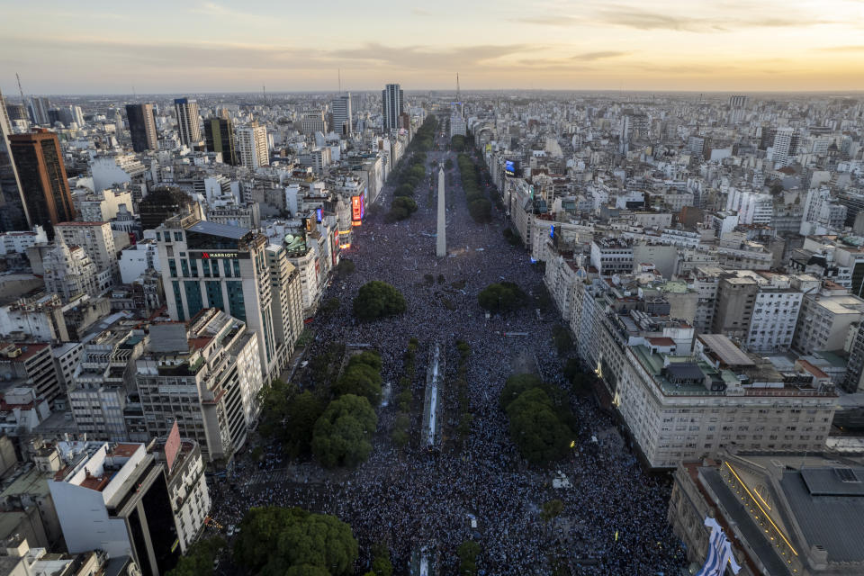 Argentine soccer fans crowd the capital's Obelisk to celebrate their team's World Cup victory over France in Buenos Aires, Argentina, Sunday, Dec. 18, 2022. (AP Photo/Rodrigo Abd