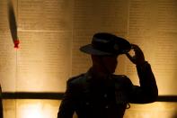 An Australian army soldier attends the dawn service to mark the 100th anniversary of ANZAC (Australian and New Zealand Army Corps) Day at the Australian National Memorial in Villers-Bretonneux, in northern France, April 25, 2015. (REUTERS/Philippe Wojazer)