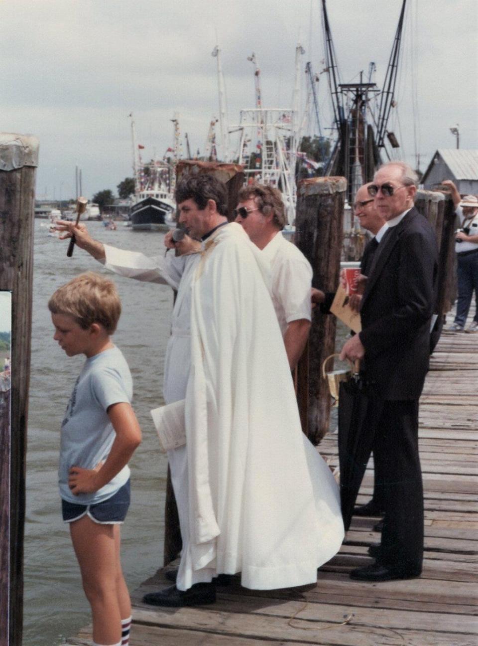 Father O'Brien of the Savannah Diocese blessing the fleet.