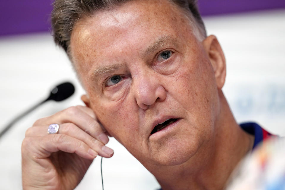 Head coach Louis van Gaal of the Netherlands adjusts his audio device during Netherlands official press conference on the eve of World Cup soccer match between Netherlands and Argentina in Doha, Qatar, Thursday, Dec. 8, 2022. (AP Photo/Eugene Hoshiko)