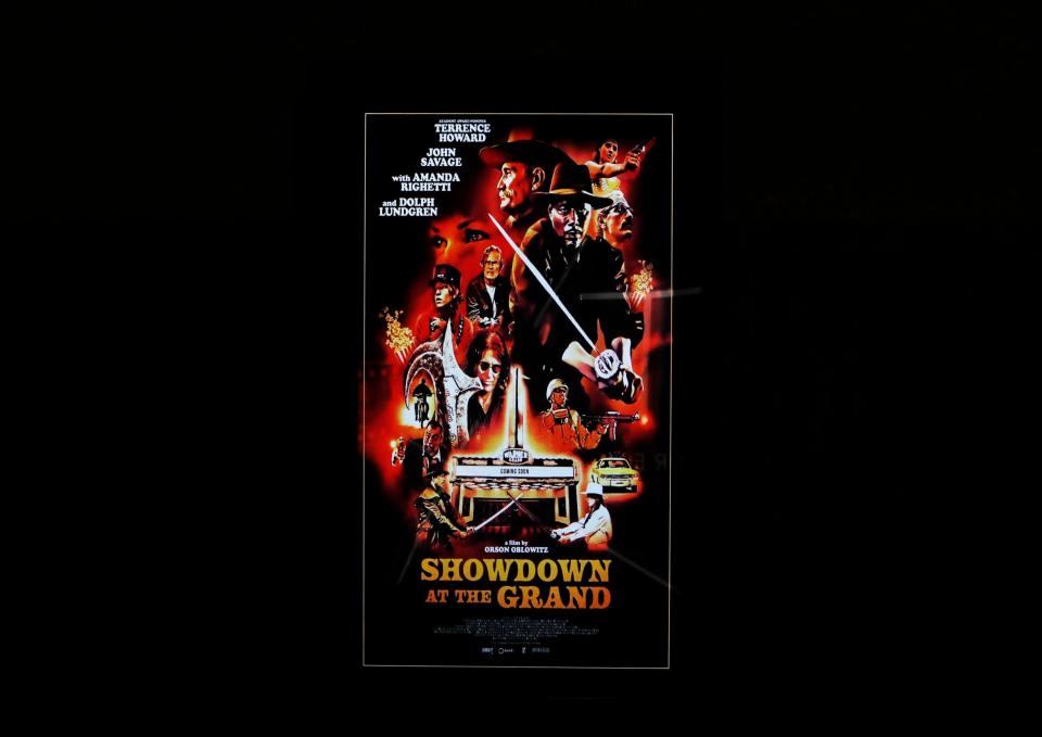 The poster for Terrence Howard's new movie, "Showdown at the Grand," hangs on the wall at the Malco Powerhouse cinema. The movie had its theatrical premiere at the Memphis theater on Wednesday, Nov. 8, 2023.