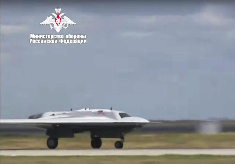 In this video grab made available on Wednesday, Aug. 7, 2019 by Russian Defense Ministry Press Service, Russia's military drone Okhotnik is seen taking off at an unidentified location in Russia. The ministry said the drone, which has stealth capabilities and is equipped with advanced reconnaissance equipment, made its maiden flight Saturday. (Russian Defense Ministry Press Service via AP)