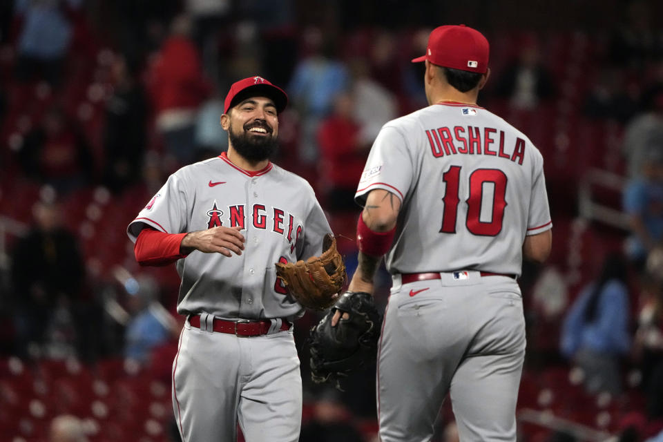 Los Angeles Angels' Anthony Rendon and Gio Urshela (10) celebrate a 5-1 victory over the St. Louis Cardinals in a baseball game Tuesday, May 2, 2023, in St. Louis. (AP Photo/Jeff Roberson)