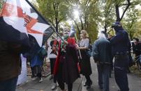 Pro-choice activists from "Women Strike" attend a protest in front of Poland's constitutional court, in Warsaw, Poland, Thursday, Oct. 22, 2020. Poland’s top court has ruled that a law allowing abortion of fetuses with congenital defects is unconstitutional. The decision by the country’s Constitutional Court effectively bans terminating pregnancies in cases where birth defects are found and will further limit access to abortions in Poland. (AP Photo/Czarek Sokolowski)