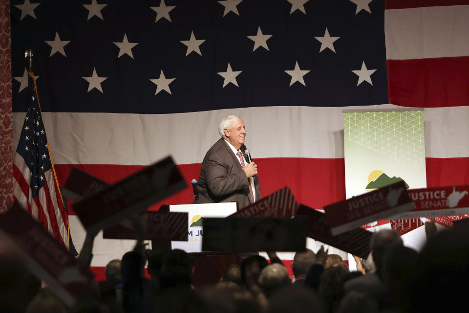 West Virginia Gov. Jim Justice walks out onto the stage during an announcement for his U.S. Senate campaign, Thursday, April 27, 2023, at The Greenbrier Resort in White Sulphur Springs, W.Va. (AP Photo/Chris Jackson)