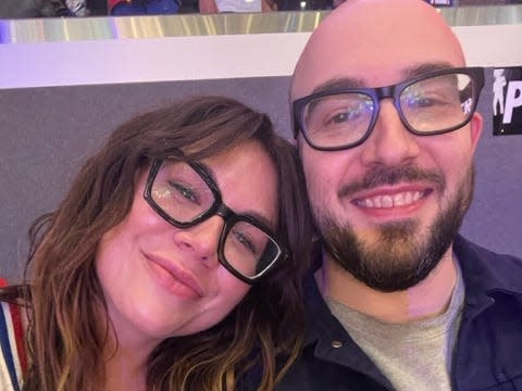 Sophia Benoit and her partner smiling and staring at the camera