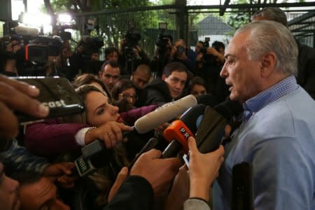 Brazil's President Michel Temer, talks with journalists after casting his vote in Sao Paulo, Brazil October 7, 2018. Marcos Correa/Brazilian Presidency/Handout via REUTERS