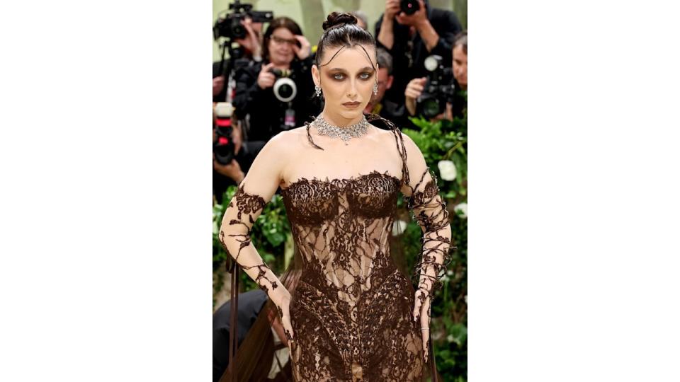 Emma Chamberlain in gothic makeup and a lace dress at the Met Gala