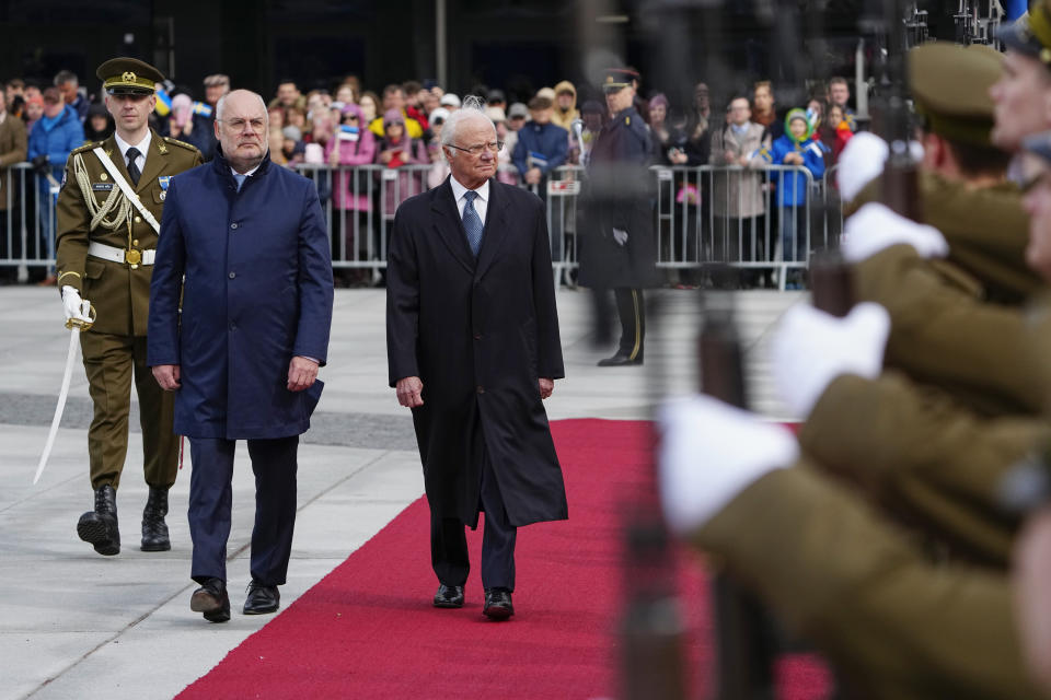 Sweden's King Carl XVI Gustaf, centre, and Estonian President Alar Karis attend an official welcoming ceremony at Vabaduse (Freedom) square in Tallinn, Estonia, Tuesday, May 2, 2023. (AP Photo/Pavel Golovkin)