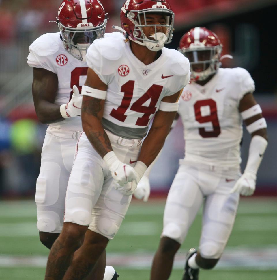 Sep 4, 2021; Atlanta, Georgia, USA;  Alabama defensive back Brian Branch (14) celebrates after making a tackle for a loss against Miami at Mercedes-Benz Stadium. Mandatory Credit: Gary Cosby-USA TODAY Sports