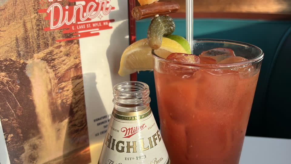 The 'Hi-Lo Bloody' at the Hi-Lo Diner in Minneapolis, Minnesota. The drink includes some unique African spices, a house-made vegan Worcestershire sauce and is skewered with a very non-vegan buffalo cheese curd and Slim Jim bit. - Courtesy Ryan Barott