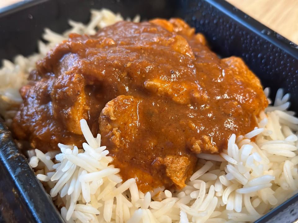 Prepared Trader Joe's butter chicken with a sauce and large portion of rice