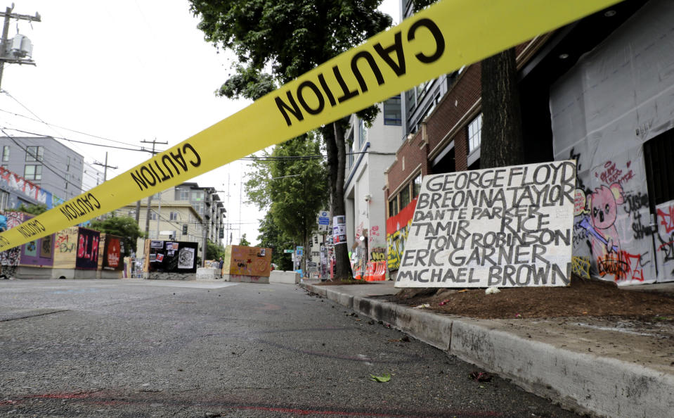 Image: Caution tape at the Capitol Hill Occupied Protest zone in Seattle on June 20, 2020. (Ted S. Warren / AP)