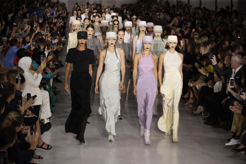 Models Joan Smalls, from front left, Gigi Hadid, Bella Hadid and Kaia Gerber wear creations with other models as part of the Max Mara Spring-Summer 2020 collection, unveiled during the fashion week, in Milan, Italy, Thursday, Sept. 19, 2019. (AP Photo/Luca Bruno)