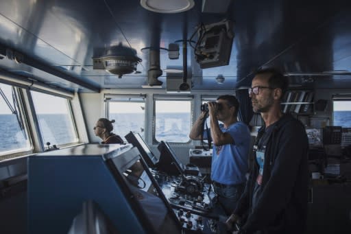 View from the bridge: Captain Mike Finchen, right, and marine biologist Thilo Maack, looking through binoculars