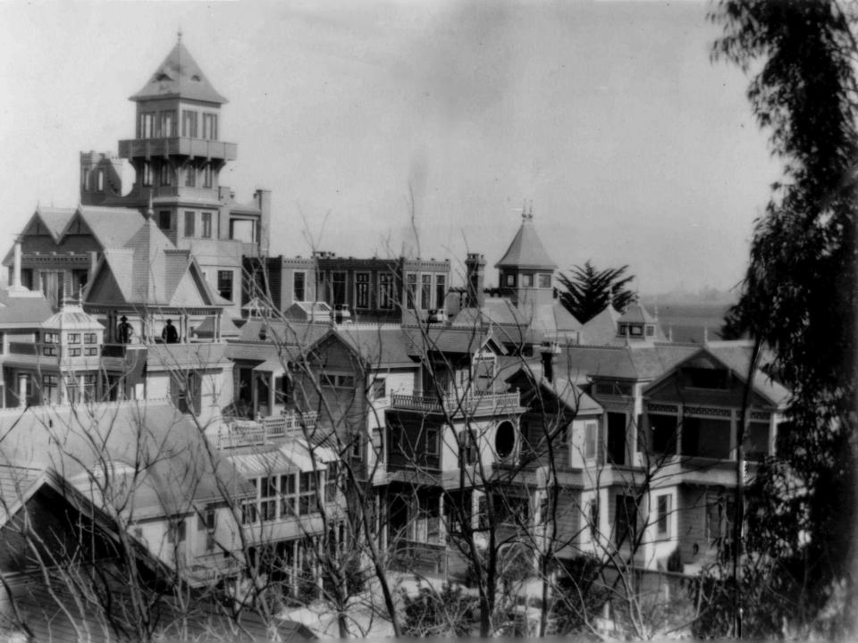 black and white photo of winchester mansion and its roof
