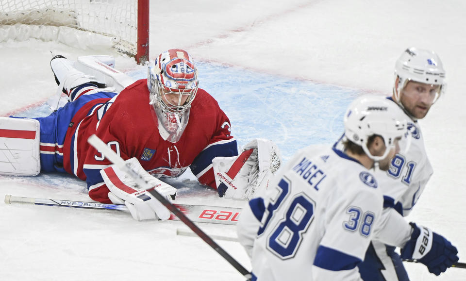 Montreal Canadiens goaltender Cayden Primeau lies on the ice after giving up a goal to Tampa Bay Lightning's Steven Stamkos (91) during the second period of an NHL hockey game in Montreal, Thursday, April 4, 2024. (Graham Hughes/The Canadian Press via AP)