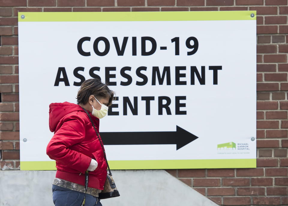 A woman arrives at the COVID-19 assessment centre at the Michael Garron Hospital in Toronto on March 24. (THE CANADIAN PRESS/Nathan Denette)