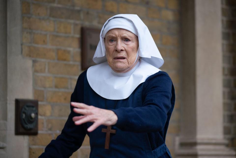 sister monica joan, nun looking surprised with hand oustretched, call the midwife