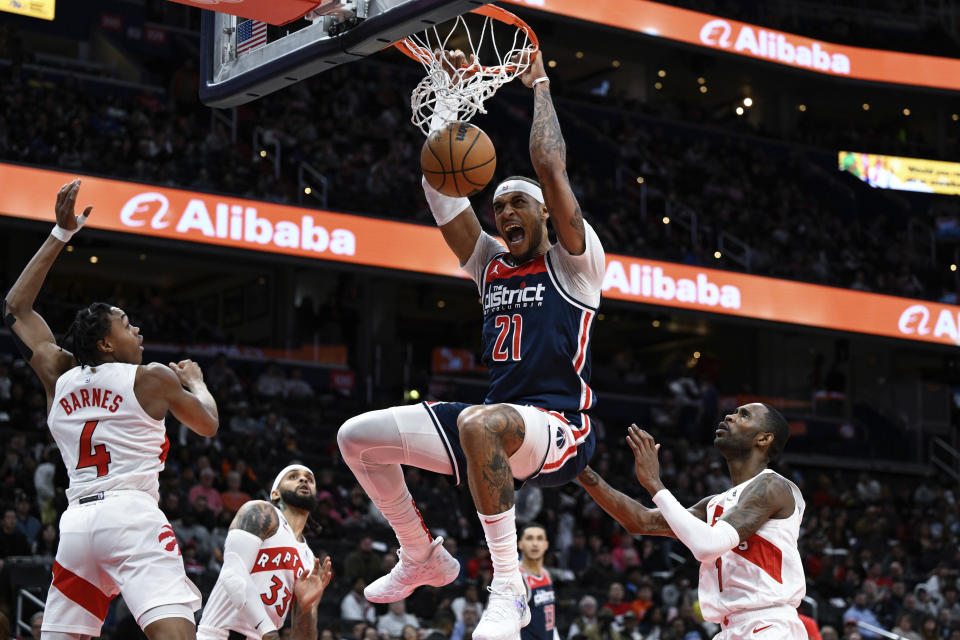 Washington Wizards center Daniel Gafford (21) dunks during the first half of an NBA basketball game against the Toronto Raptors, Saturday, March. 4, 2023, in Washington. (AP Photo/Terrance Williams)