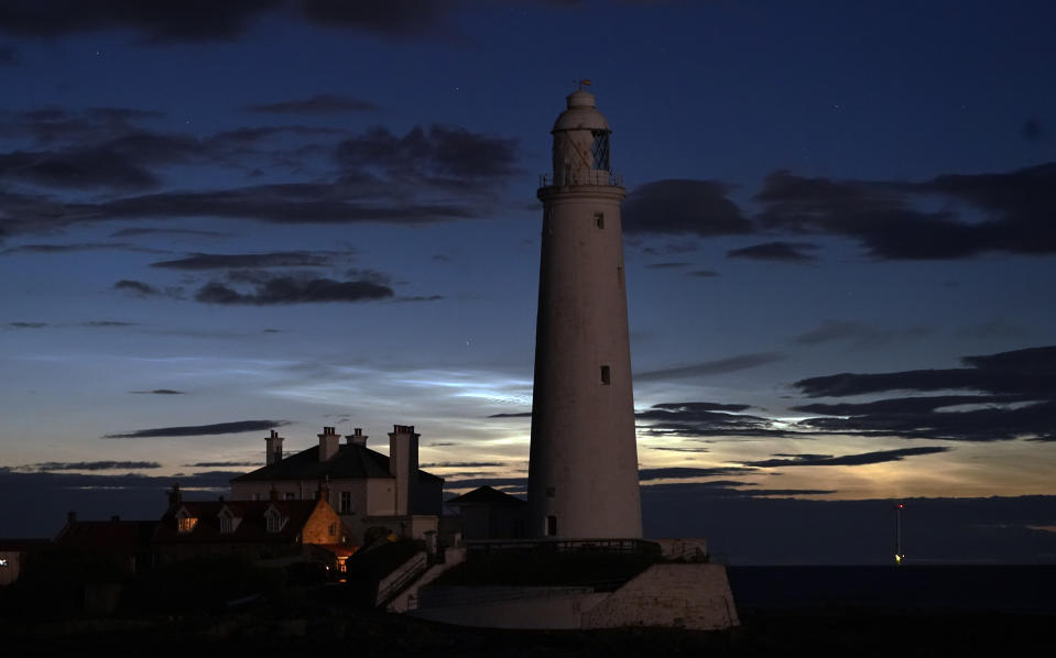 Noctilucent clouds or night clouds forming behind St Mary's Lighthouse in Whitley Bay. The clouds appear when the sun is 6-16 degrees below the Horizon. (Photo by Owen Humphreys/PA Images via Getty Images)