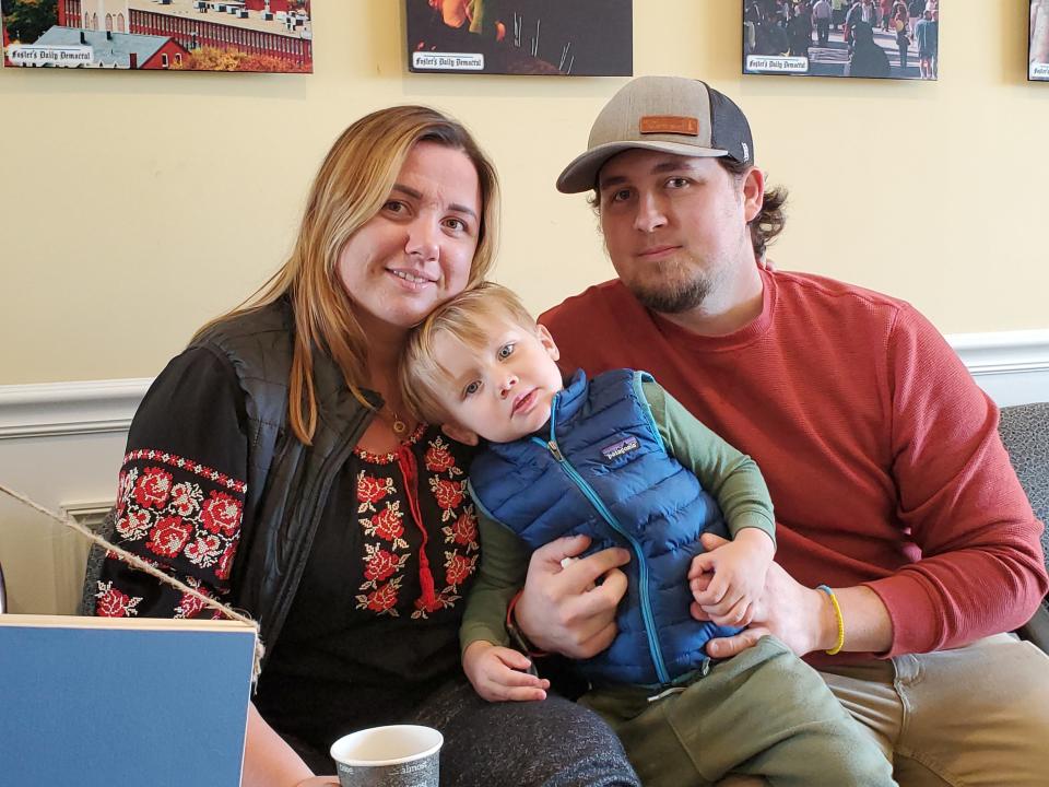 Kateryna and Dan Ridley with the son Logan volunteer at a donation drive packaging event for items being sent to Ukraine Sunday, March 13, 2022 at the Greater Dover Chamber of Commerce. The couple hopes they can one day take their son to visit Ukraine.