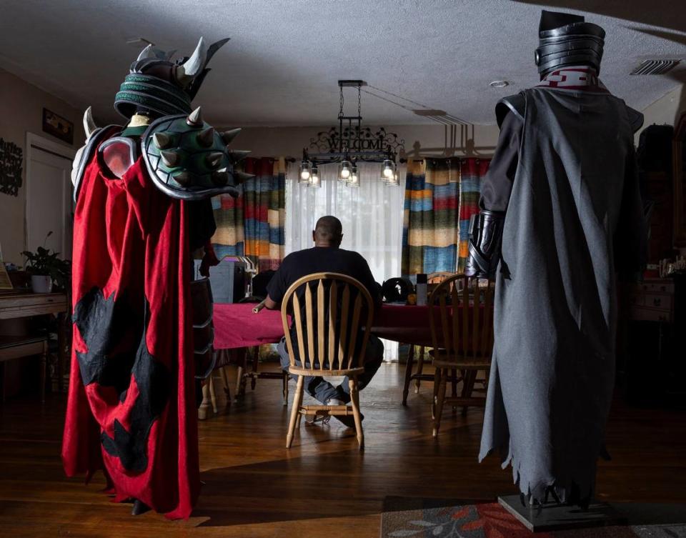 Matthew Harden, 34, works on his costume at his sister Michaela Alphonse’s house in North Miami.
