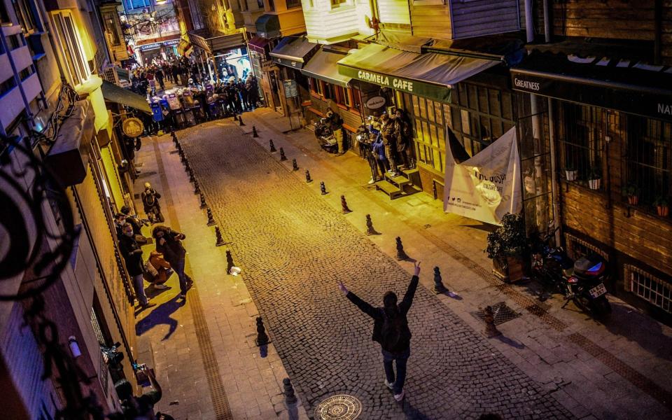 A protester confronting a wall of police officers in Istanbul last month - GETTY IMAGES