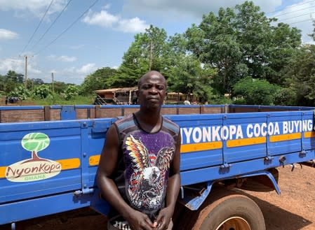 Ghanian cocoa farmer, Kwabena Badu, 49, attends an interview with Reuters near a cocoa warehouse in the village of Essam