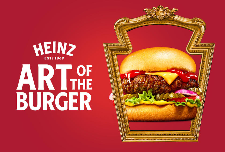 A burger behind an empty picture frame, on a red screen with text