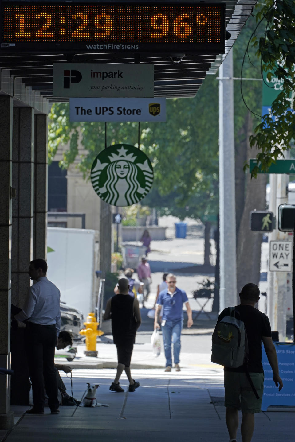 A parking garage sign shows the temperature at 96 degrees Fahrenheit in the shade, Monday, June 28, 2021, in downtown Seattle. Seattle and other cities broke all-time heat records over the weekend, with temperatures soaring well above 100 degrees Fahrenheit (37.8 Celsius). (AP Photo/Ted S. Warren)