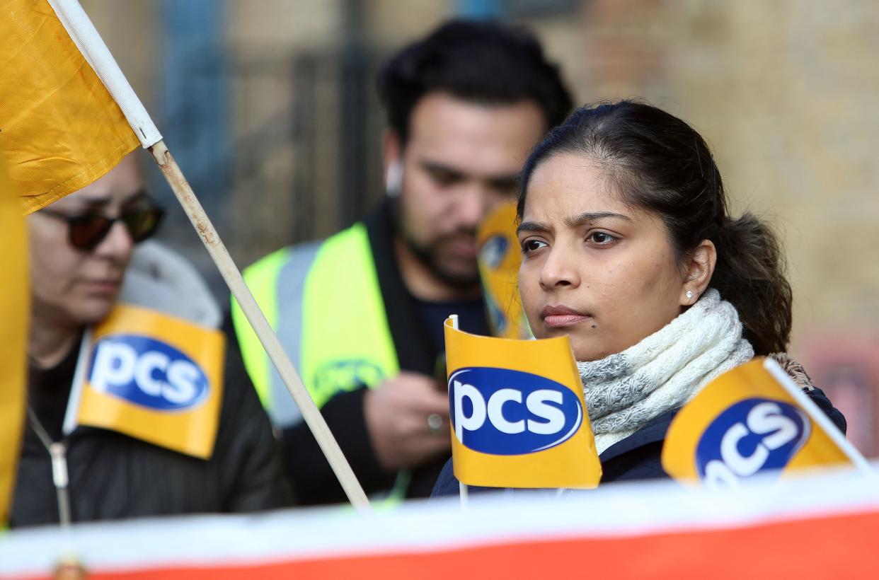 Members of the Public and Commercial Services (PCS) union stand on a picket line on the first day of a five-week strike by UK passport office workers, in London on April 3, 2023. - UK passport office workers launched a five-week stoppage Monday, the latest walkout in strike-hit Britain as the country reels from the worst cost of living crisis in a generation. The Public and Commercial Services union (PCS) accused the government of failing to deal even handedly with public sector workers. (Photo by Susannah Ireland / AFP) (Photo by SUSANNAH IRELAND/AFP via Getty Images)