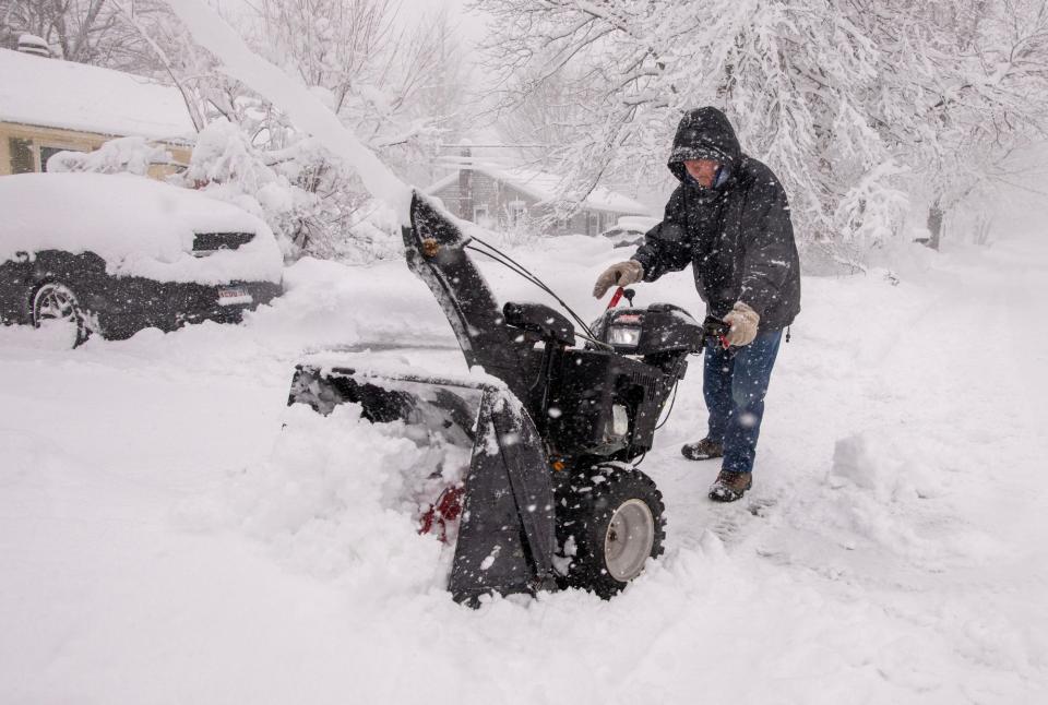 ASHBURNHAM - Paul Horgan clears his driveway for the second time before noon Tuesday.